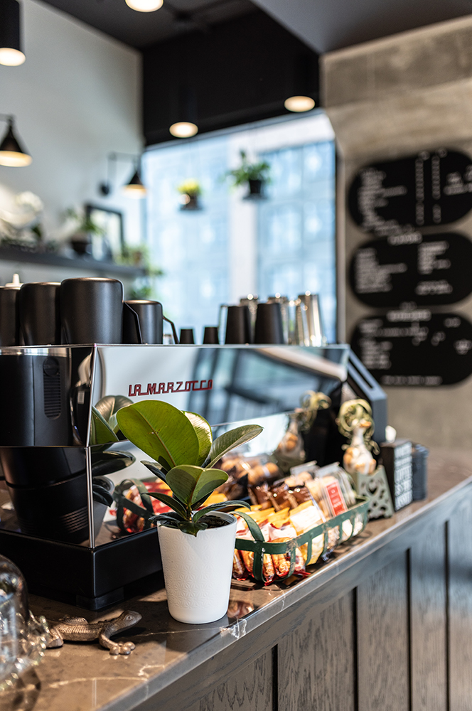 close up of counter highlighting the espresso machine
