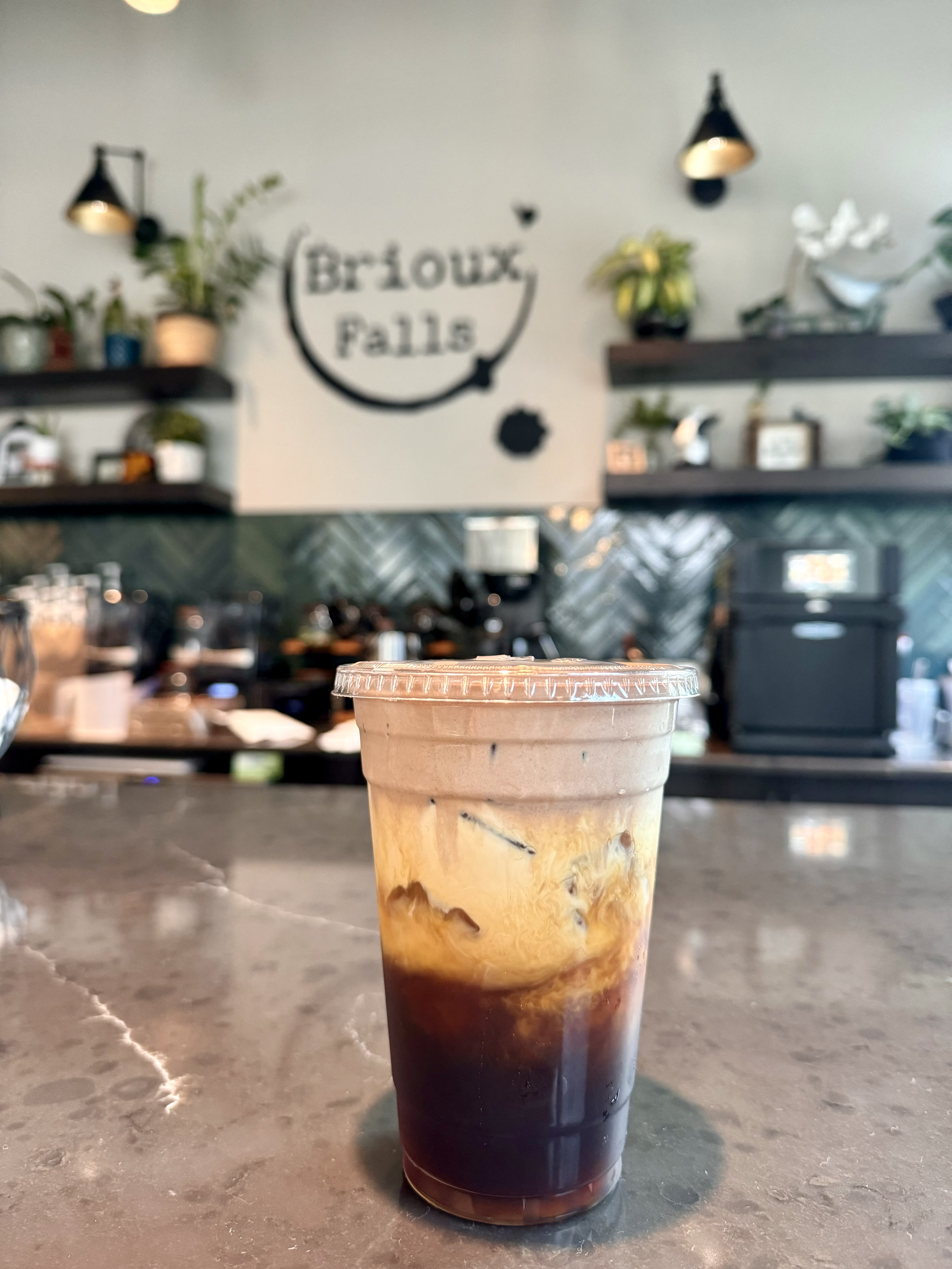 Cold Brioux in front of Logo